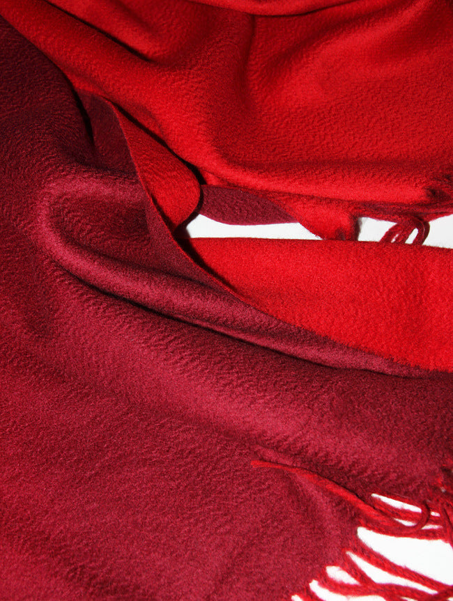 Maroon-Ruby-Indulge in the supreme luxury of our cashmere shawl, a masterpiece crafted from the finest 100% pure cashmere sourced from the serene plains of Inner Mongolia, China. This exquisite creation is the epitome of warmth and sophistication, designed for those who appreciate life's finer pleasures.