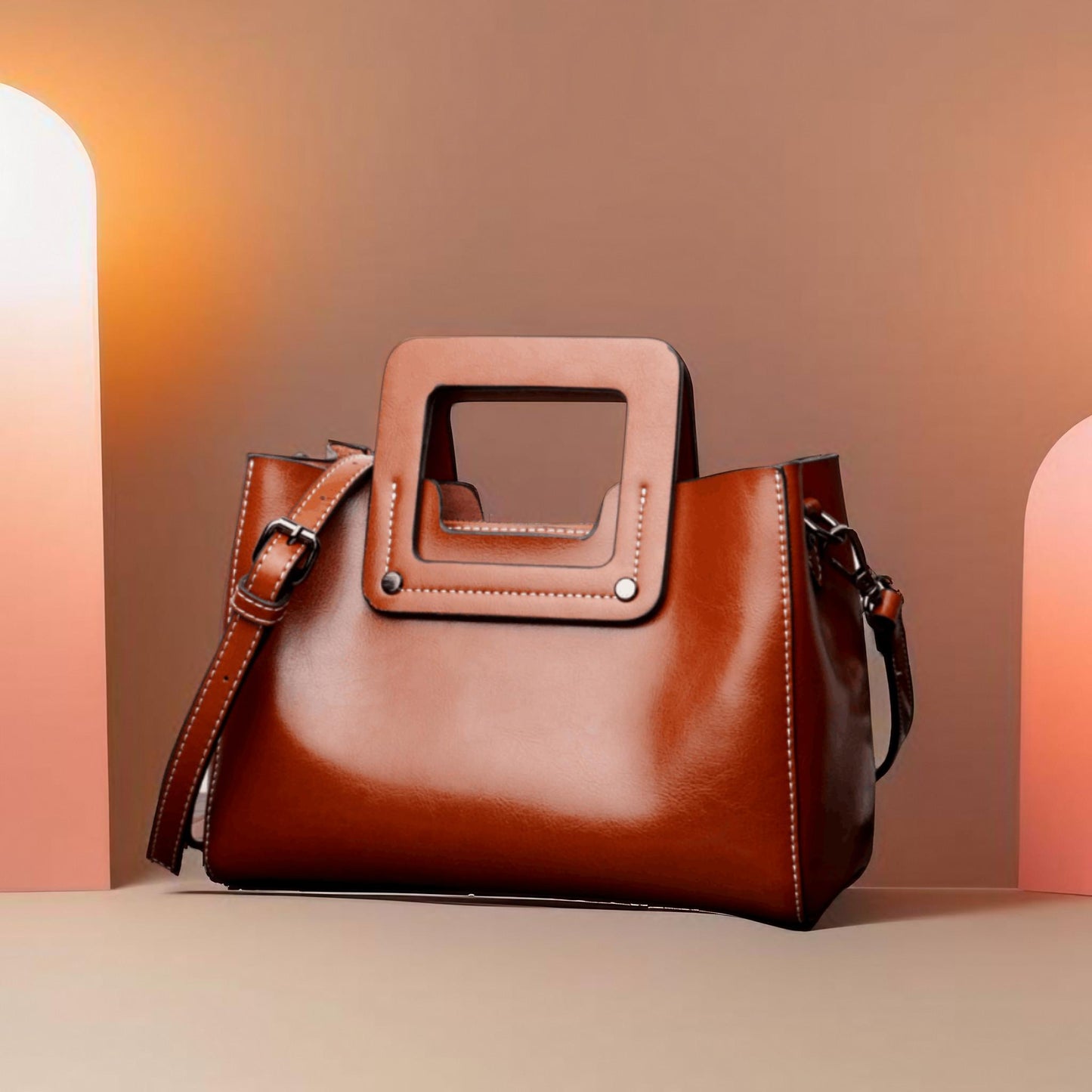 Crafted with a daring sense of design, Quatrefoil Charm Satchel features striking square handles that not only turn heads with their contemporary flair but also securely support the weight of your essentials